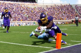 GREENVILLE, NC - SEPTEMBER 08: East Carolina Pirates running back Anthony Scott (3) dives for touchdown past North Carolina Tarheels safety D.J. Ford (16) in the first quarter of a game between the North Carolina Tarheels and the East Carolina Pirates on September 8, 2018, at the Dowdy-Ficklen Stadium in Greenville, North Carolina. (Photo by Jay Anderson/Icon Sportswire)