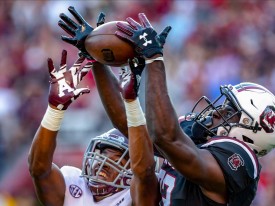 COLUMBIA, SC - OCTOBER 13: South Carolina Gamecocks wide receiver Chavis Dawkins (83) makes a touchdown catch over Texas A&M Aggies defensive back Charles Oliver (21) on October 13, 2018, at Williams-Brice Stadium in Columbia, SC. The Aggies won the game 26-23. (Photo by Jay Anderson/Icon Sportswire)
