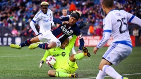 Oct. 23, 2016; Foxborough, MA, USA;  New England Revolution midfielder Lee Nguyen (24) gets tangled with Montreal Impact goalkeeper Evan Bush (1) during an MLS match between Montreal Impact and the New England Revolution at Gillette Stadium. Photo credit: Jay Anderson - KLC fotos